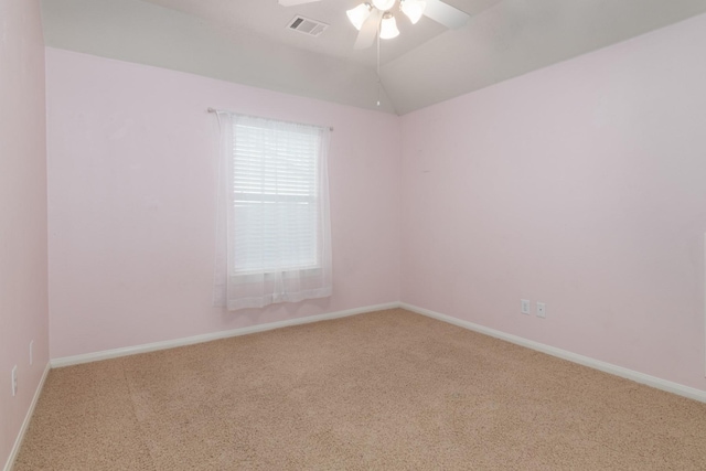 spare room featuring ceiling fan, carpet floors, and lofted ceiling