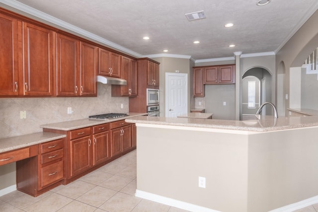 kitchen featuring tasteful backsplash, stainless steel appliances, crown molding, light tile patterned floors, and a center island with sink