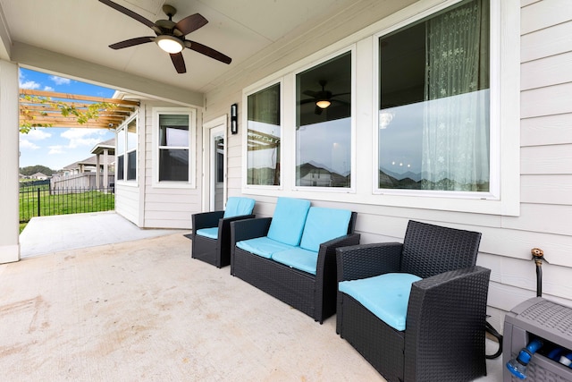 view of patio / terrace with ceiling fan and a pergola