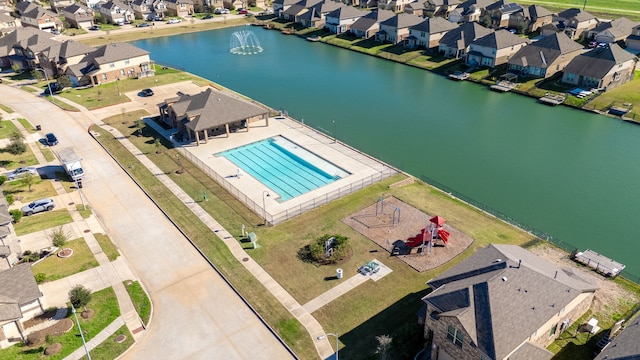 birds eye view of property with a water view