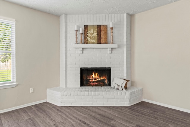 interior details with hardwood / wood-style flooring, a fireplace, and a textured ceiling