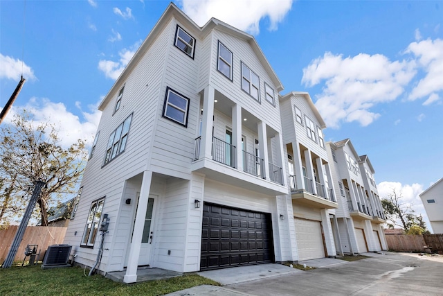 exterior space featuring a garage and central AC