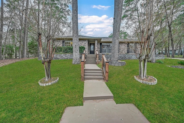 ranch-style home with a front yard