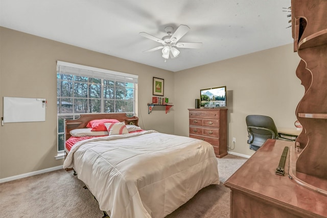 bedroom featuring light colored carpet and ceiling fan