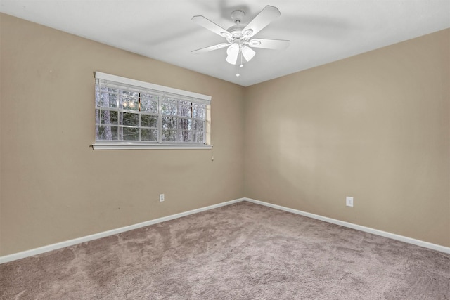 empty room with ceiling fan and carpet floors