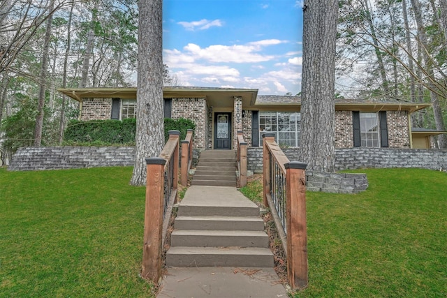 ranch-style home with a front lawn