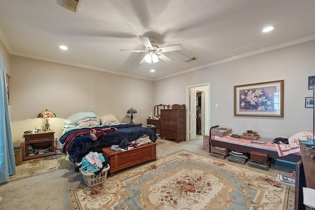 bedroom featuring light carpet, ceiling fan, crown molding, a spacious closet, and a closet