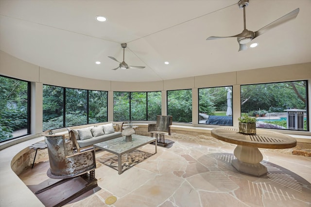 sunroom featuring vaulted ceiling