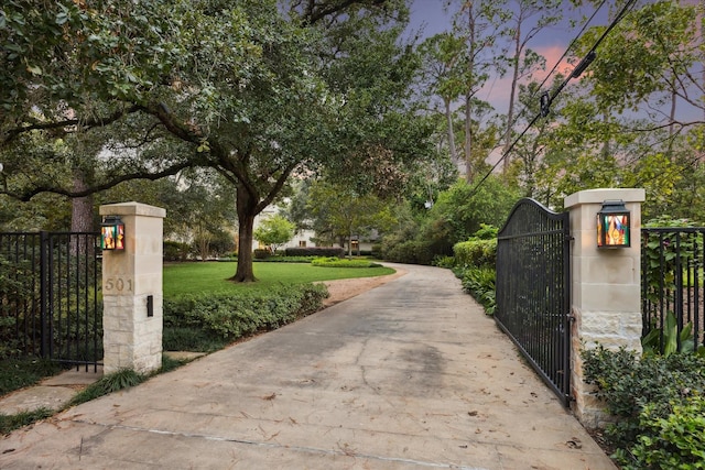 view of gate at dusk