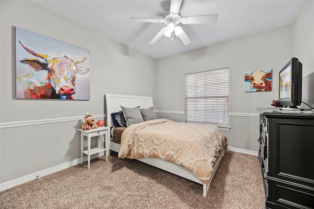 bedroom featuring ceiling fan and carpet