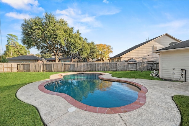 view of swimming pool featuring a patio and a lawn