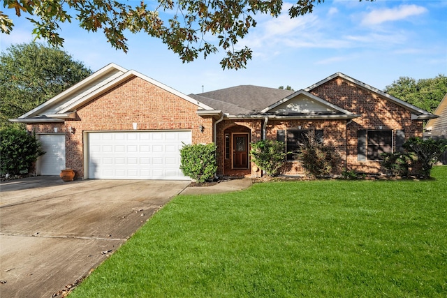 view of front of house featuring a garage and a front yard