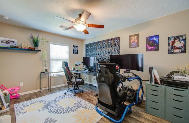 office space featuring a textured ceiling, hardwood / wood-style flooring, and ceiling fan