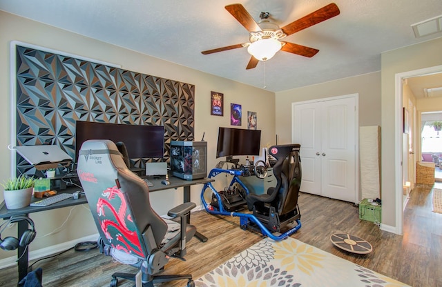 office featuring hardwood / wood-style floors and ceiling fan