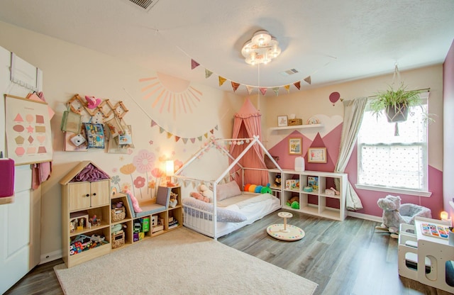 bedroom featuring hardwood / wood-style floors