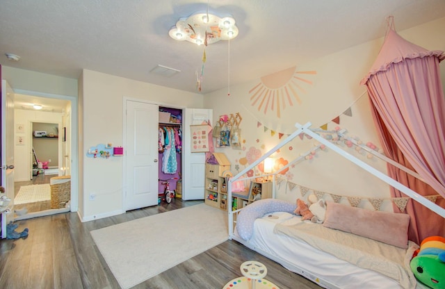 bedroom featuring a closet and wood-type flooring