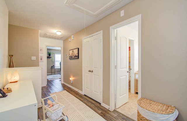 hall with hardwood / wood-style floors