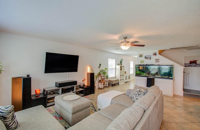 living room featuring ceiling fan and light tile patterned floors