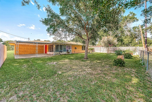 view of yard featuring a patio and a fenced backyard