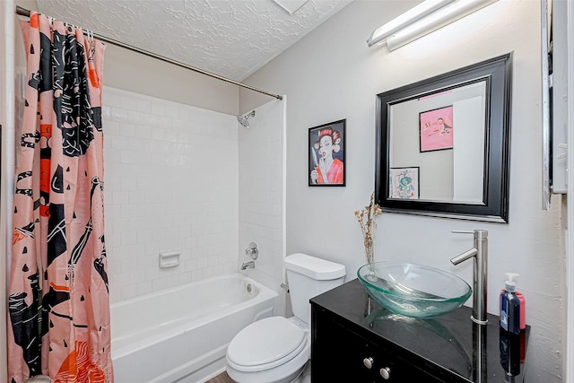 full bathroom with vanity, toilet, shower / bathtub combination with curtain, and a textured ceiling