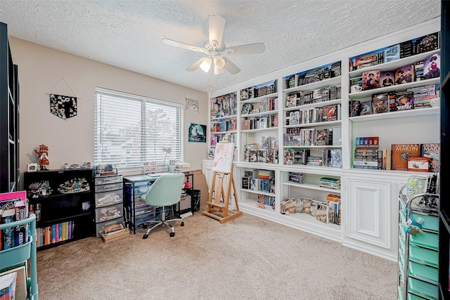 office with carpet flooring, ceiling fan, and a textured ceiling