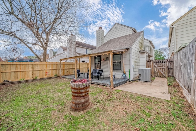 back of property featuring central AC unit, a patio area, a deck, and a yard