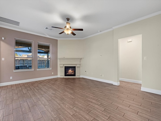 unfurnished living room featuring ceiling fan, light hardwood / wood-style flooring, and ornamental molding