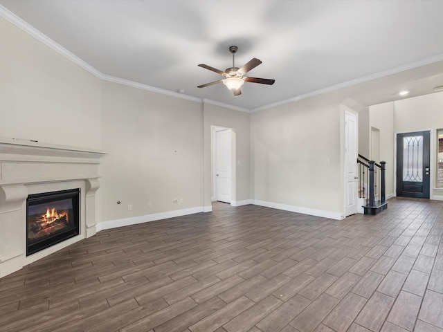 unfurnished living room with ceiling fan and ornamental molding