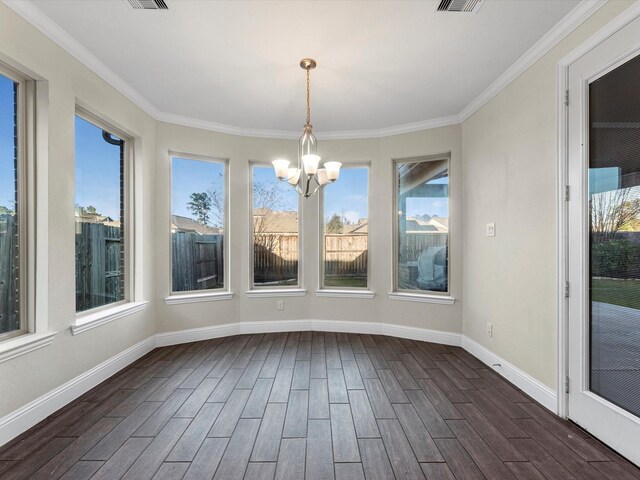 unfurnished sunroom featuring a healthy amount of sunlight and a notable chandelier