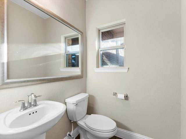 bathroom with toilet and sink