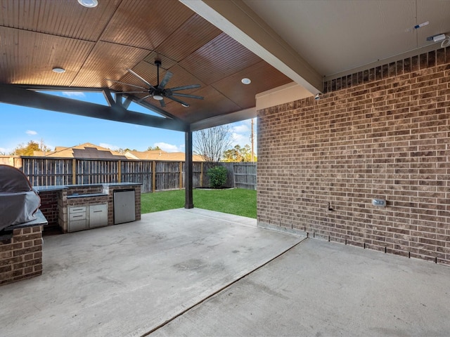 view of patio with ceiling fan and exterior kitchen