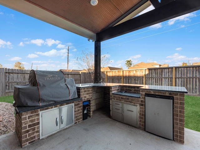 view of patio / terrace featuring area for grilling and exterior kitchen