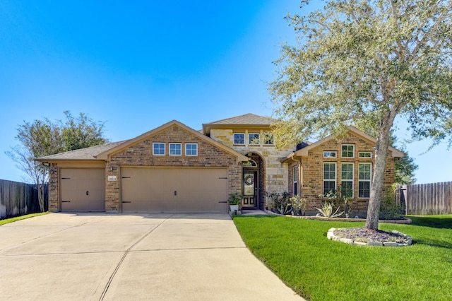 view of front facade featuring a front yard and a garage