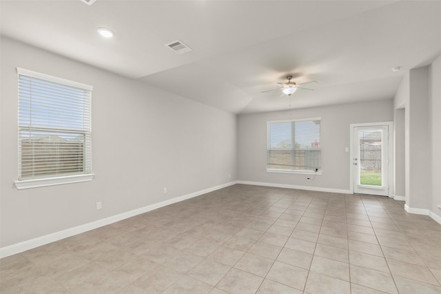 unfurnished room featuring light tile patterned floors, ceiling fan, and lofted ceiling