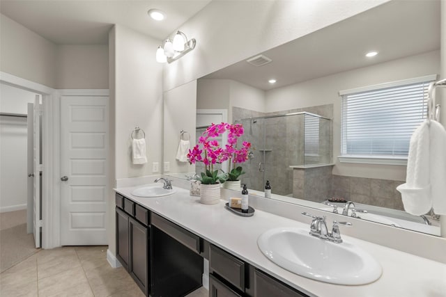 bathroom featuring tile patterned floors, vanity, and separate shower and tub