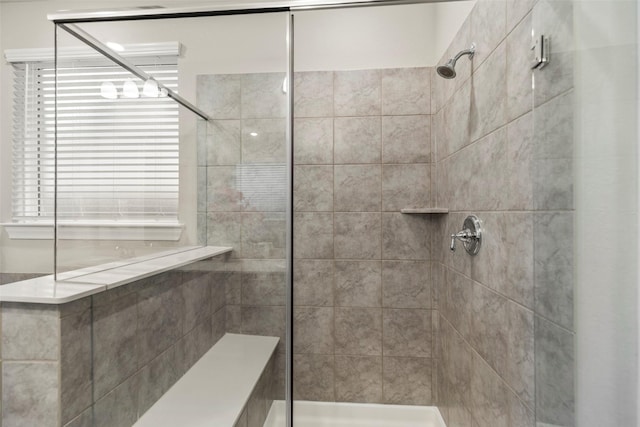 bathroom featuring tiled shower