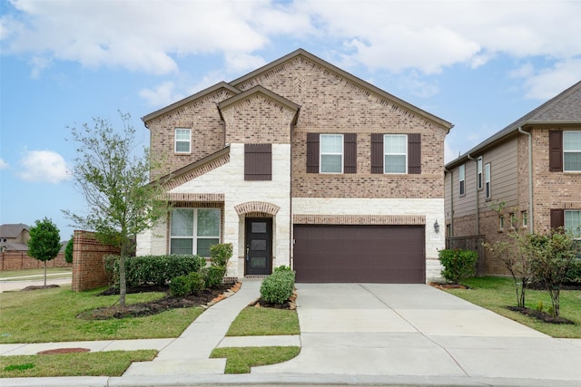 view of front of property with a garage and a front lawn