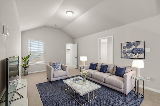 living room with light colored carpet and vaulted ceiling