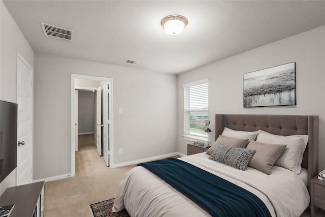 bedroom featuring light colored carpet