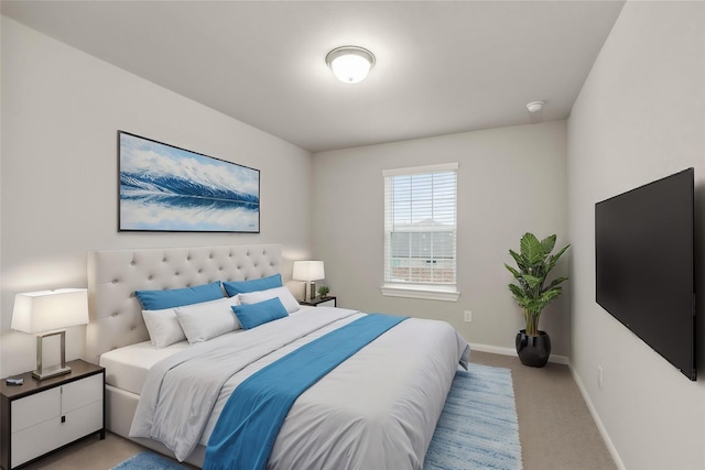 bedroom featuring light carpet