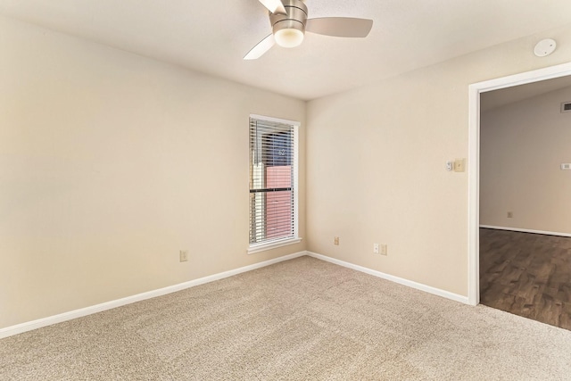 carpeted empty room with ceiling fan