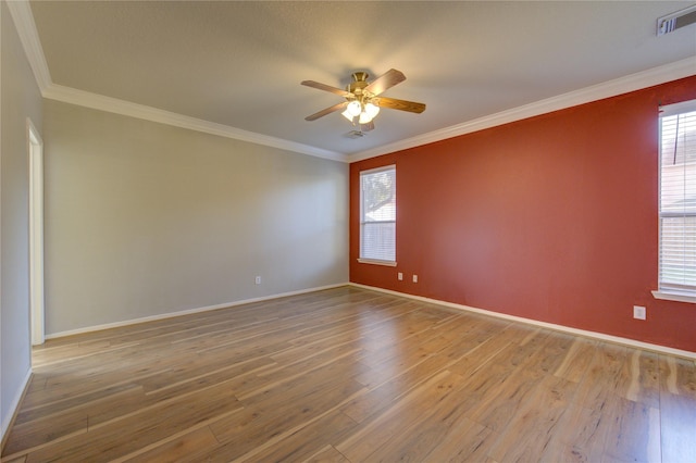 unfurnished room featuring ceiling fan, hardwood / wood-style floors, and ornamental molding