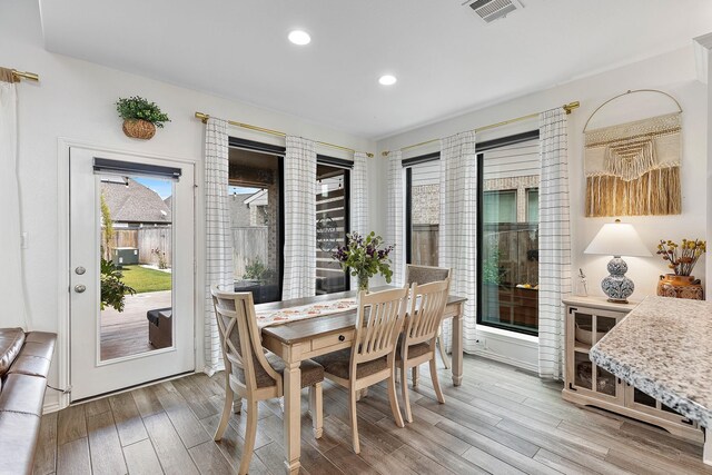 dining area with hardwood / wood-style flooring