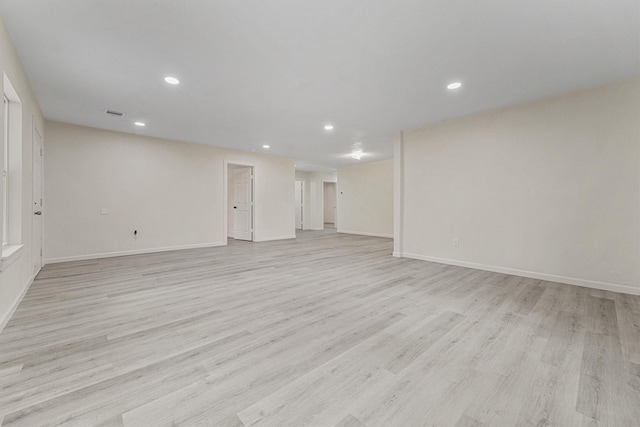 unfurnished living room with light hardwood / wood-style flooring