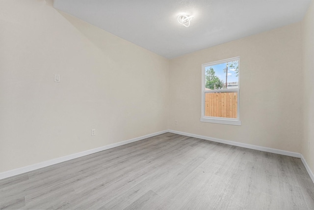 unfurnished room with light hardwood / wood-style floors