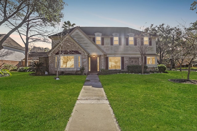 view of front of property with a yard