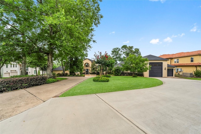 view of front facade with a garage and a front lawn