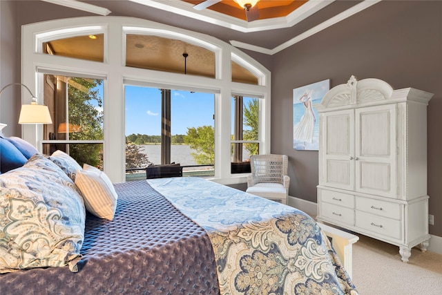 bedroom with ornamental molding, a water view, carpet floors, and ceiling fan