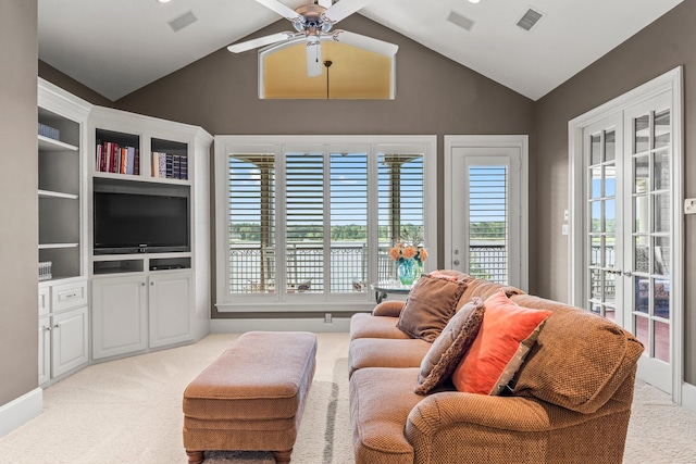 carpeted living room with lofted ceiling, a healthy amount of sunlight, ceiling fan, and french doors