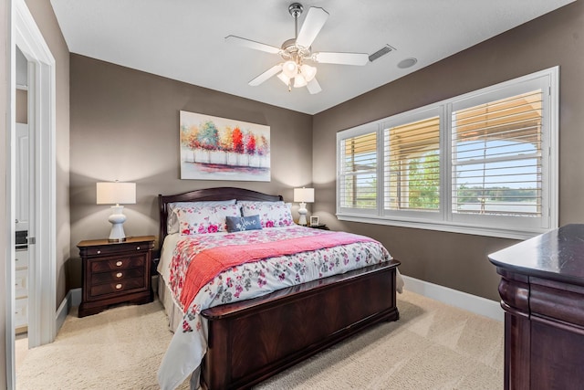 carpeted bedroom with ceiling fan